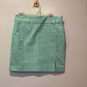 Light green skirt.